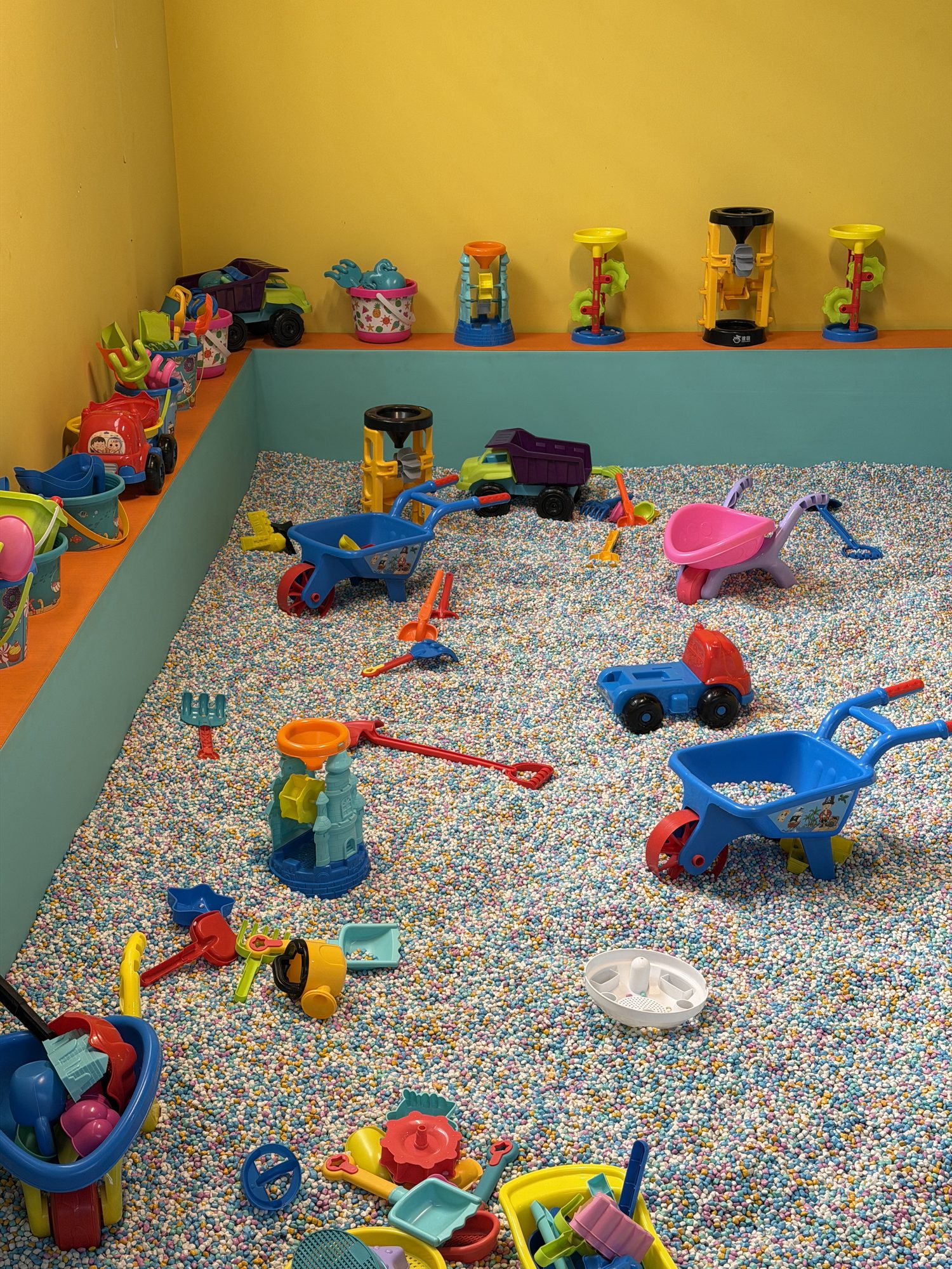 Sand pit with toys at the Saddar location